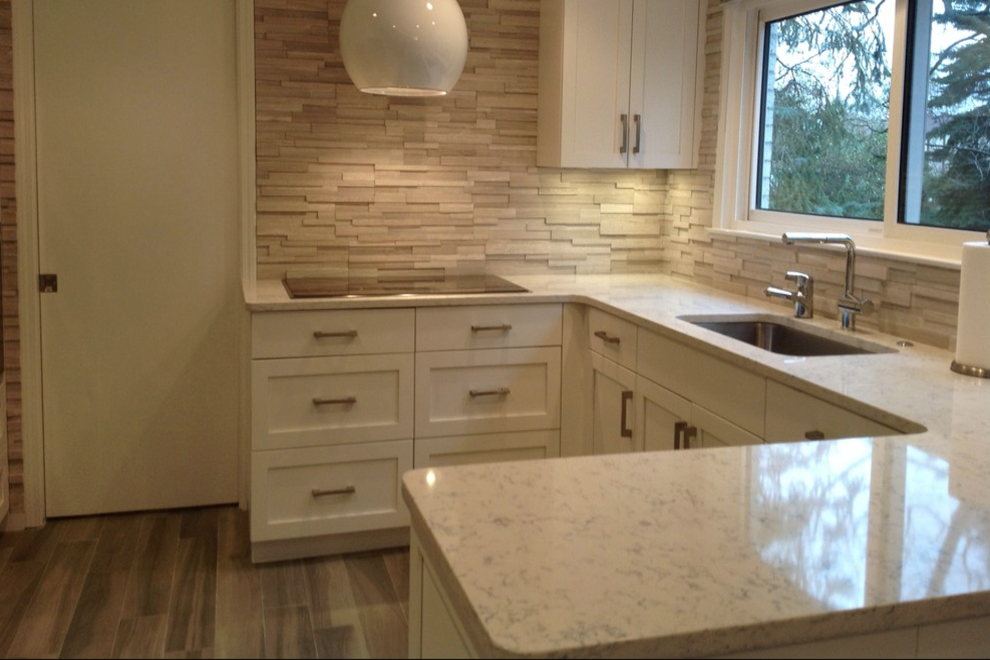 Lyra quartz counters white shaker cabinets porcelain tile floor cream backsplash