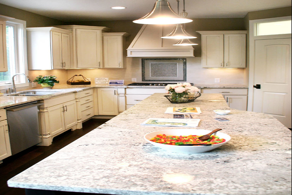 bianco romano granite counter tops white cabinets dark wood floor cream tile backsplash