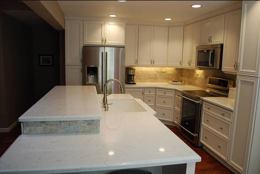 cambria torquay countertops cream travertine backsplash white cabinets dark wood floor solid subtle warm granite space cost stainless free brown veins room maintenance soft modern contrast bright lovely white base carrara counter