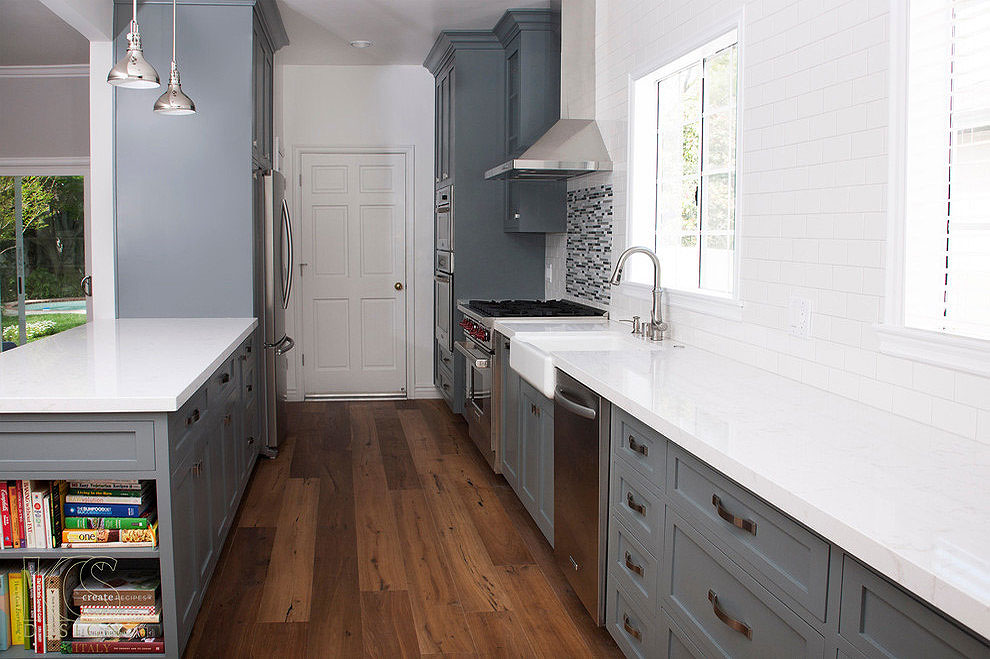 cambria torquay kitchen counters gray cabinets dark wood floor white tile backsplash