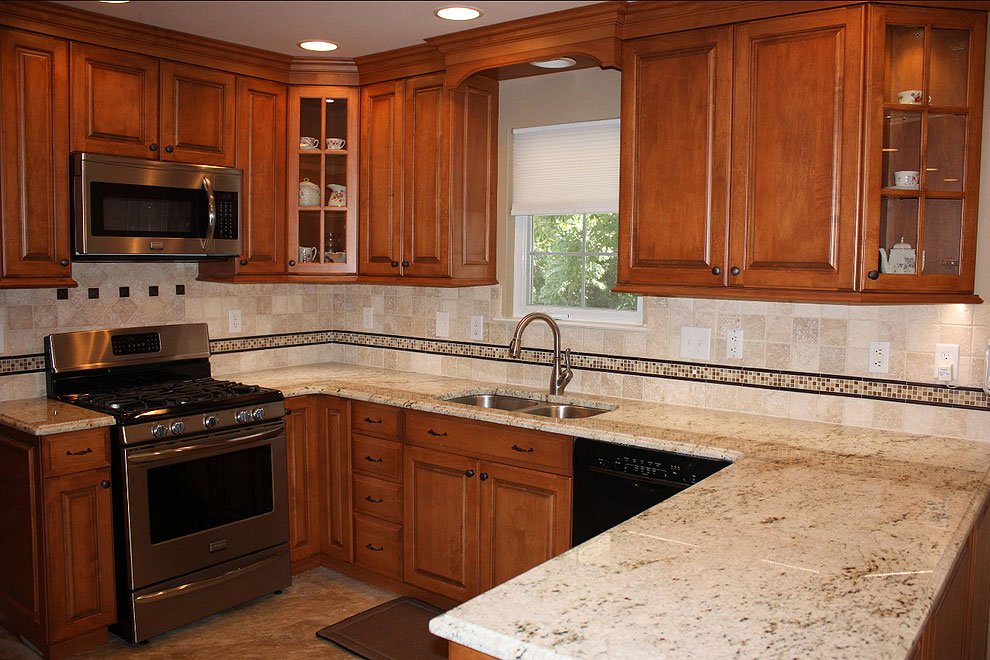 colonial gold granite kitchen counters beige travertine backsplash brown cabinets friday