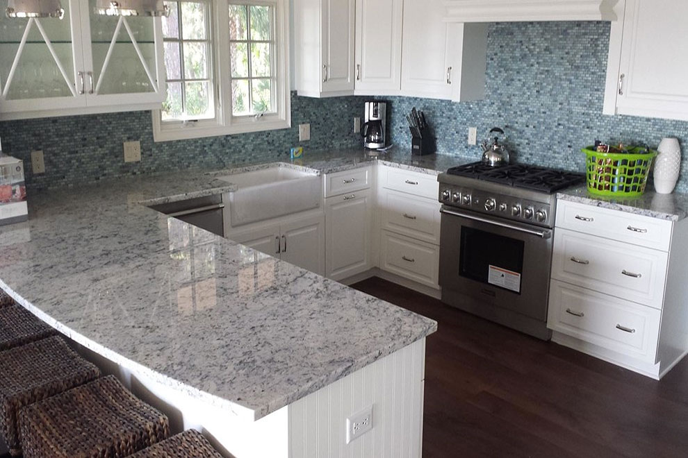 colonial white countertops dark flooring mosaic tile white cabinets