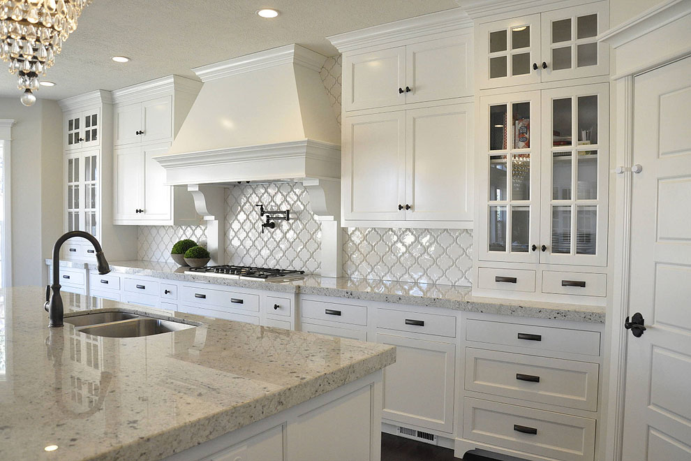 colonial white granite countertop shaker cabinets with arabesque tile