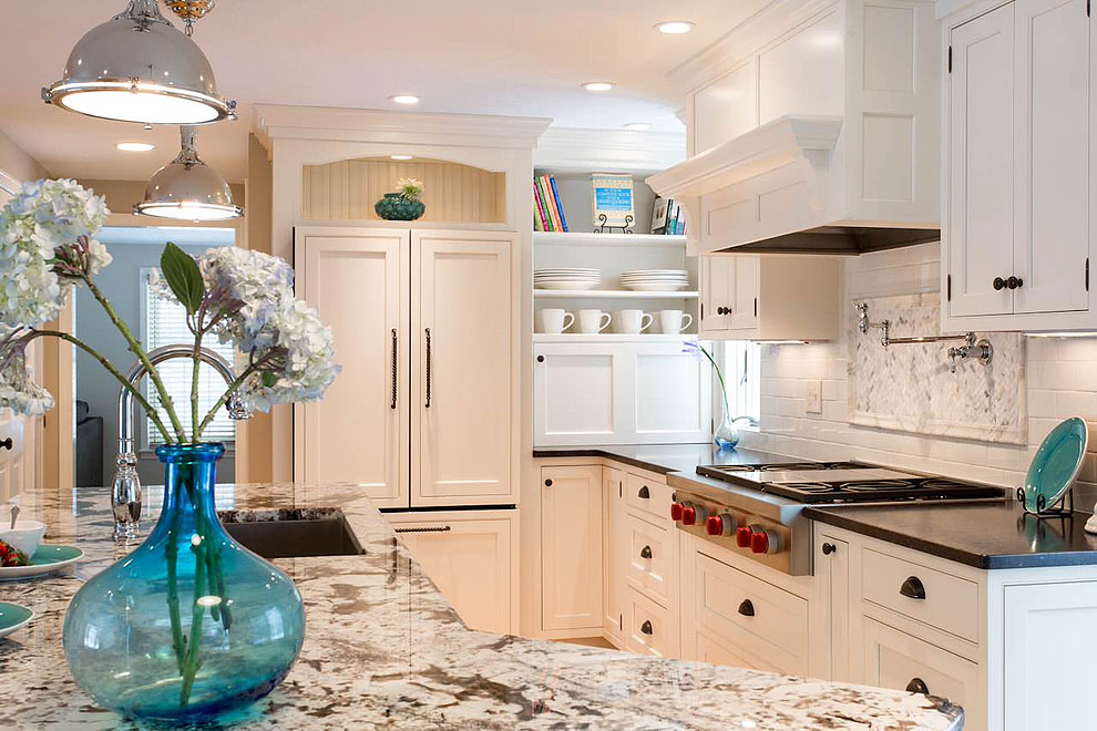 crema delicatus countertops white shaker cabinets tile backsplash wood floor 