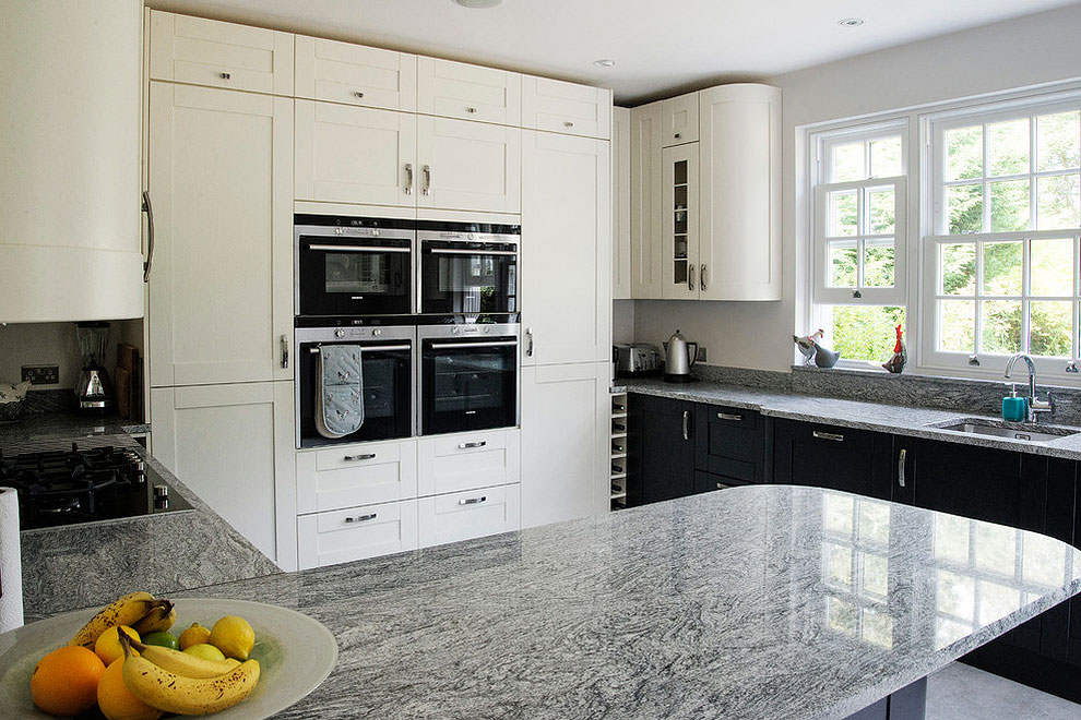 viscount white granite countertops white shaker wall cabinets dark base cabinets beige floor granite