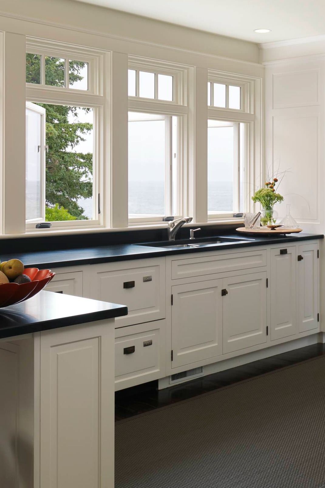 Dark Stained Wood Floor White Cabinets Honed Black Granite Counters 1