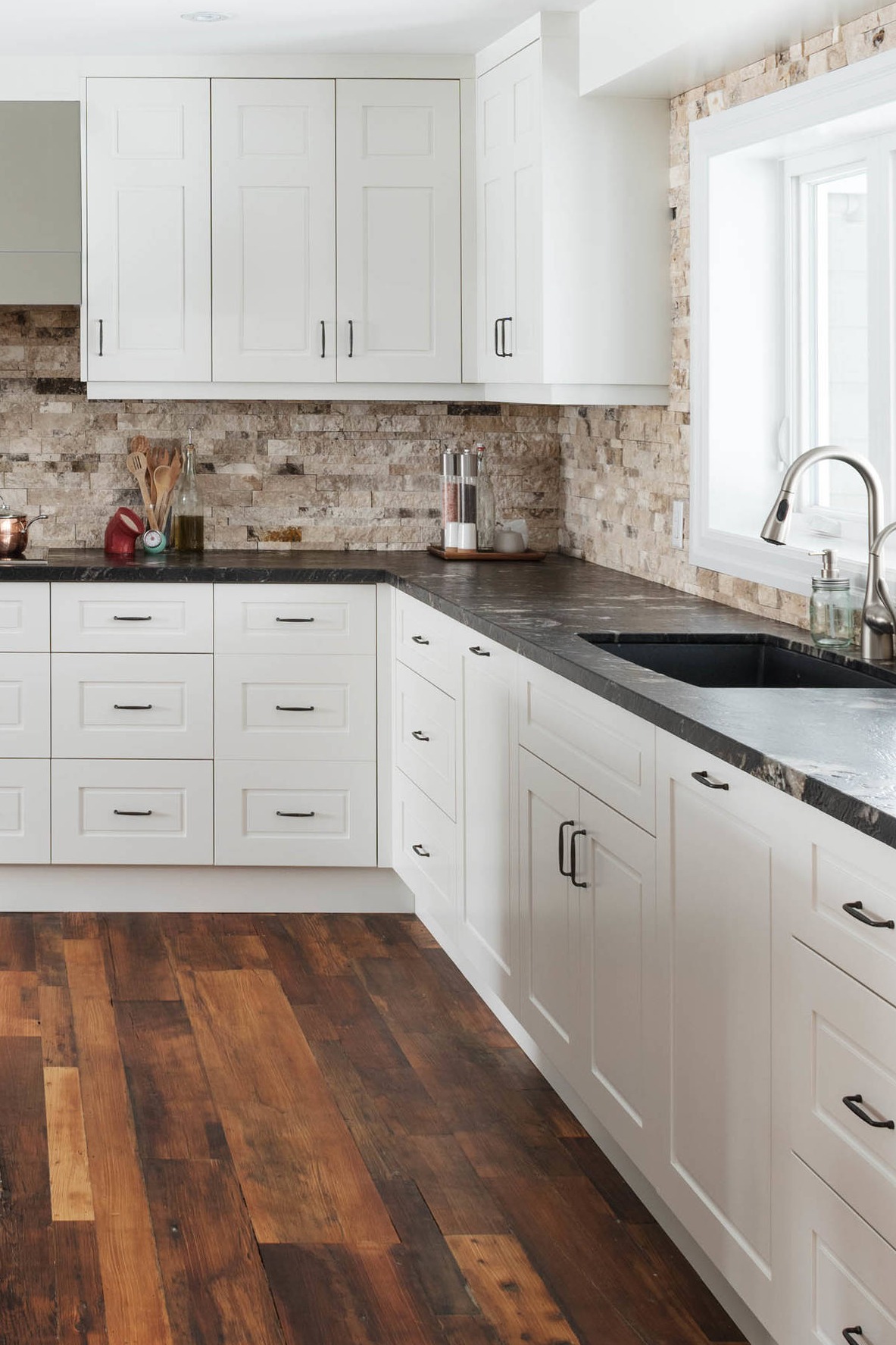 Honed Titanium Granite Countertop White Cabinet Brick Style Backsplash Dark Hardwood Floor 1