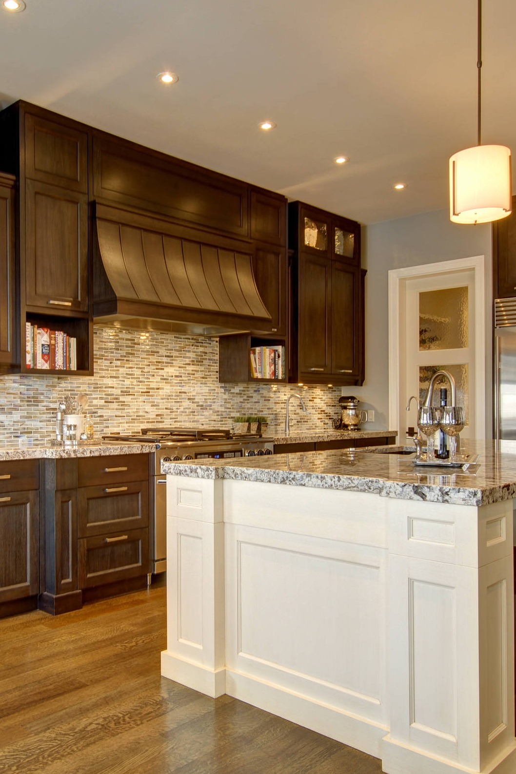 Azul Aran Granite Countertop Mosaic Tile Backsplash Dark Stained Hardwood Floor White Island Brown Kitchen Cabinetry