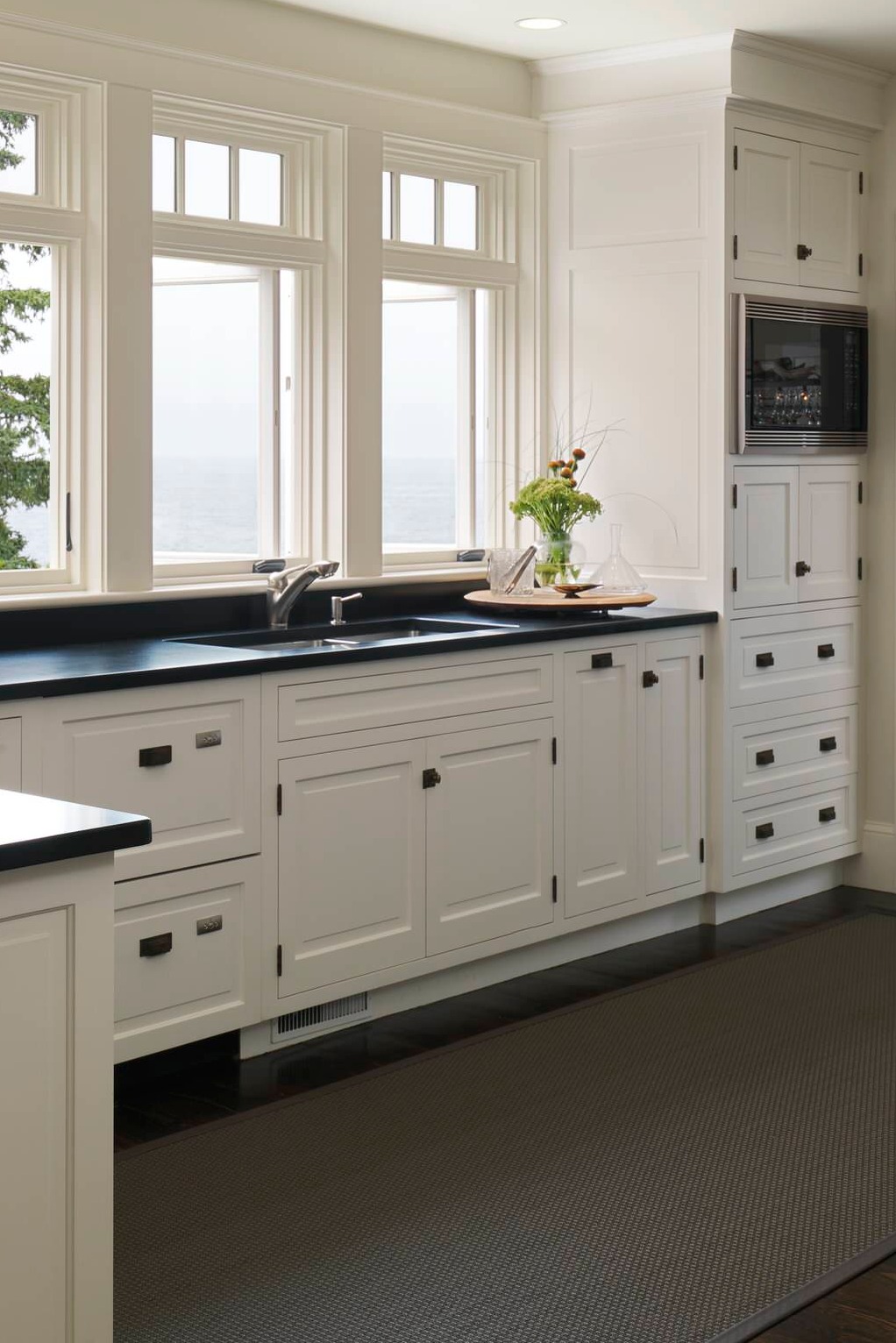 Honed Black Granite Counters White Cabinet Dark Hardwood Floor Handles