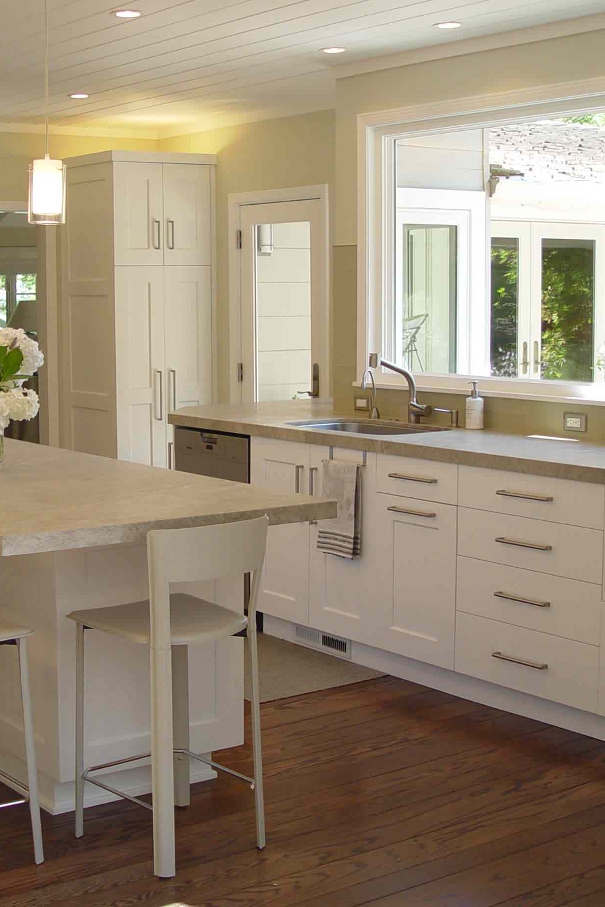 Mother Of Pearl Quartzite Countertops White Cabinets Dark Hardwood Floor Glass Backsplash