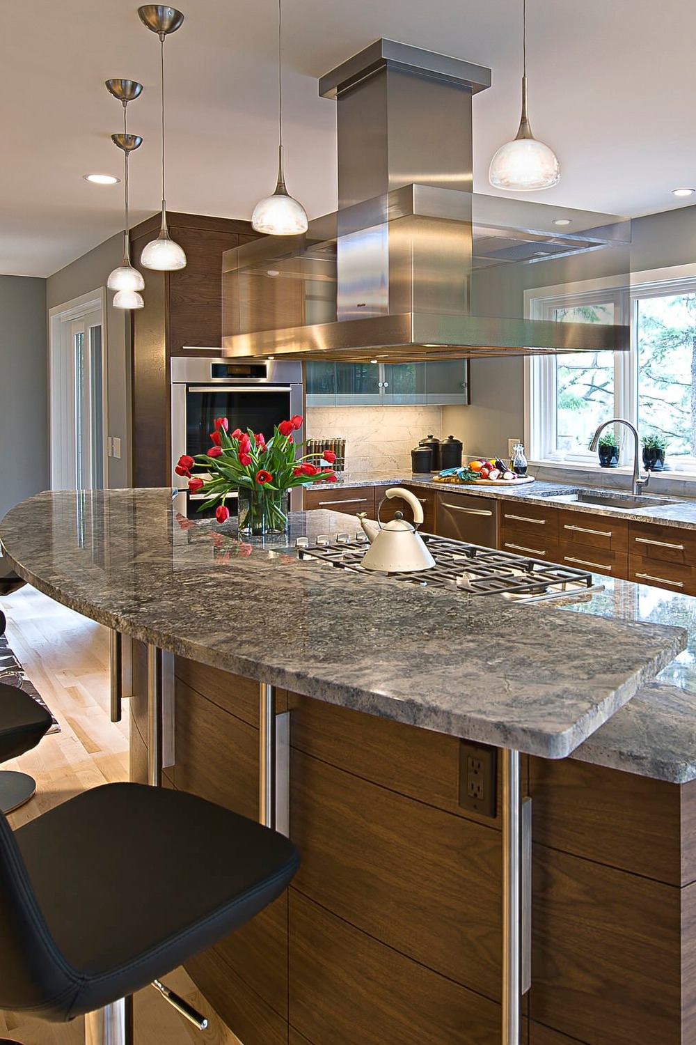 Azul Aran Granite Countertops Brown Cabinets Light Hardwood Floor Marble Backsplash