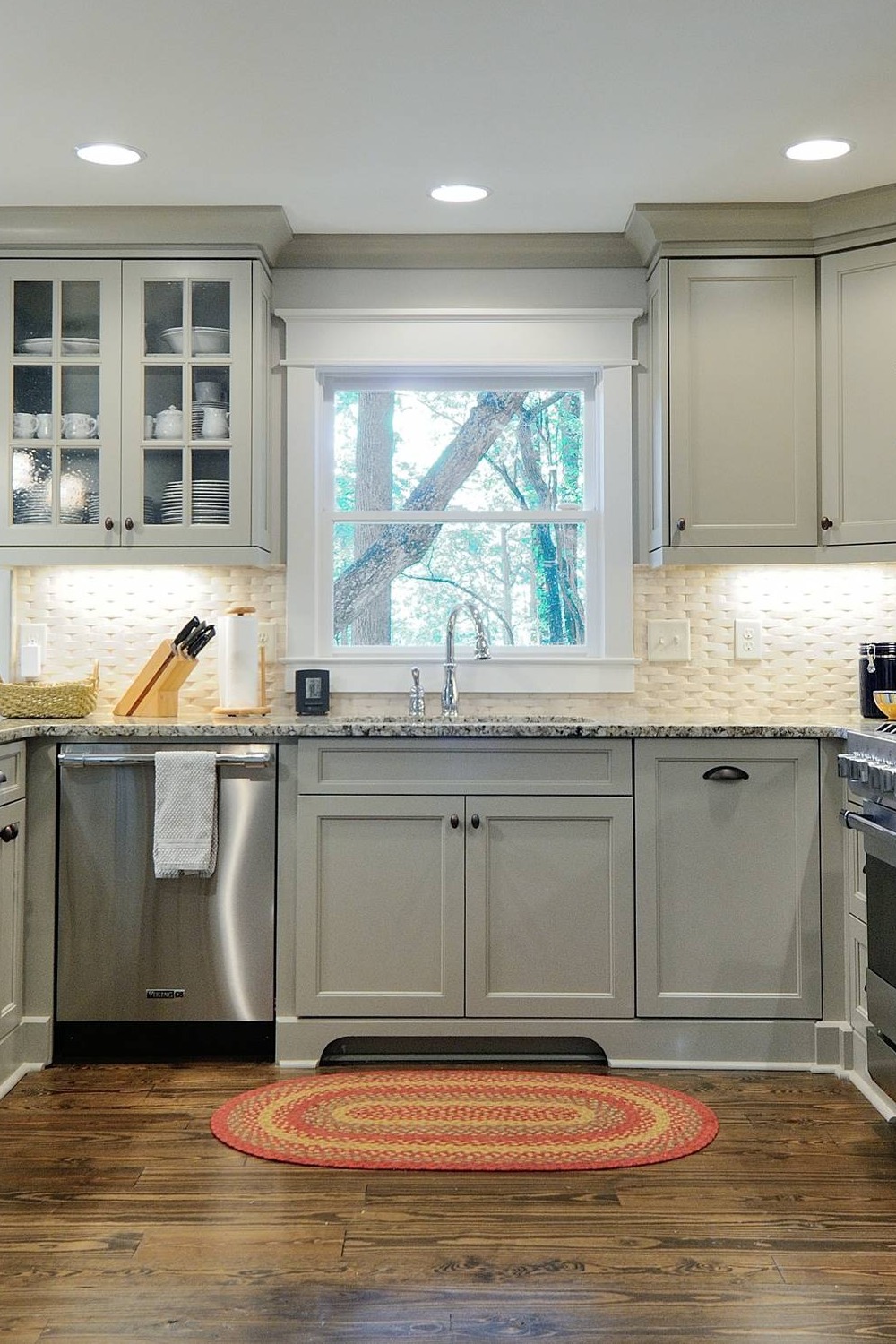 Light Gray Cabinets White Textured Backsplash Granite Countertops Dark Hardwood Floor