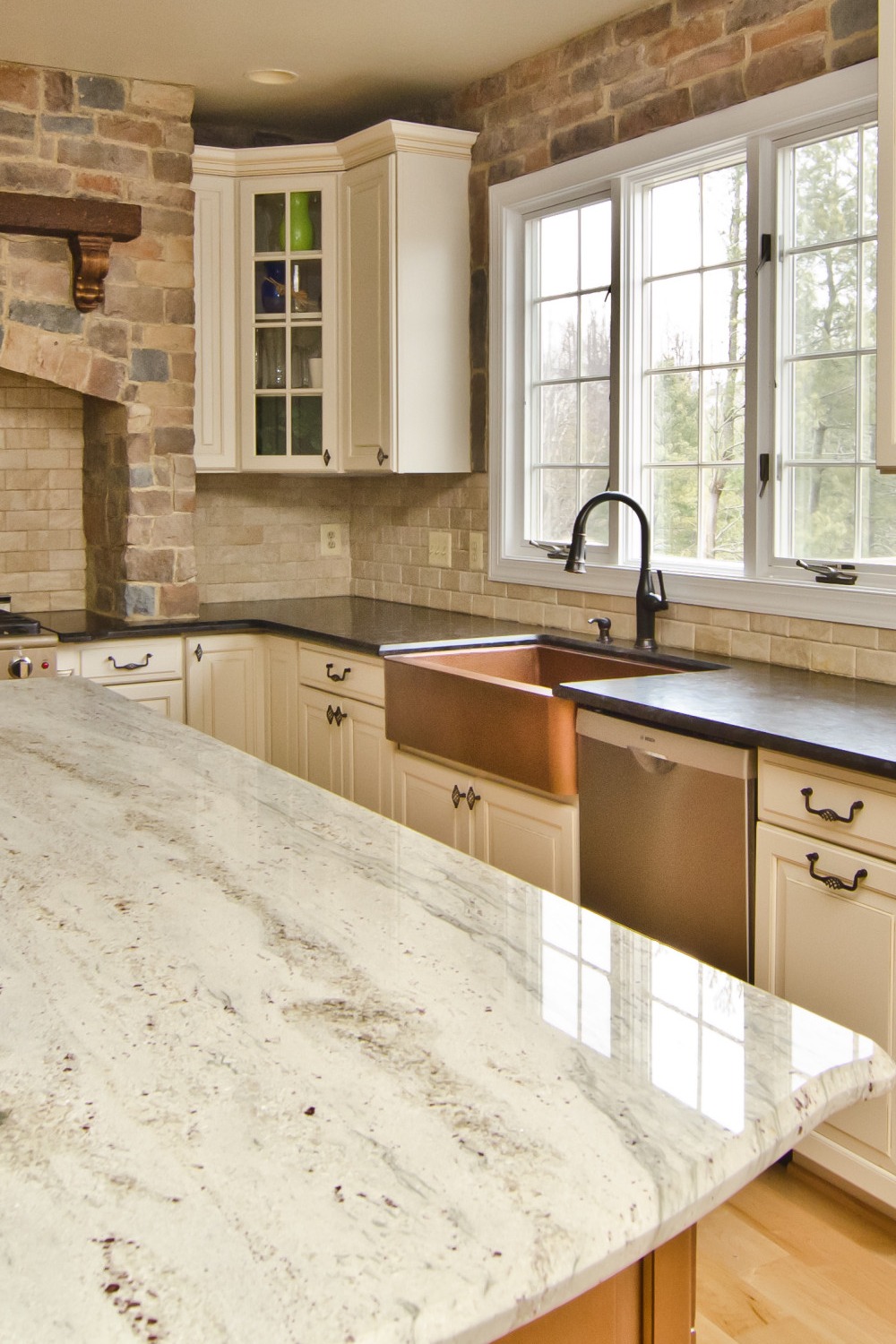Cream Subway Style Backsplash Glacier White Granite Countertops Cabinets Light Hardwood Flooring