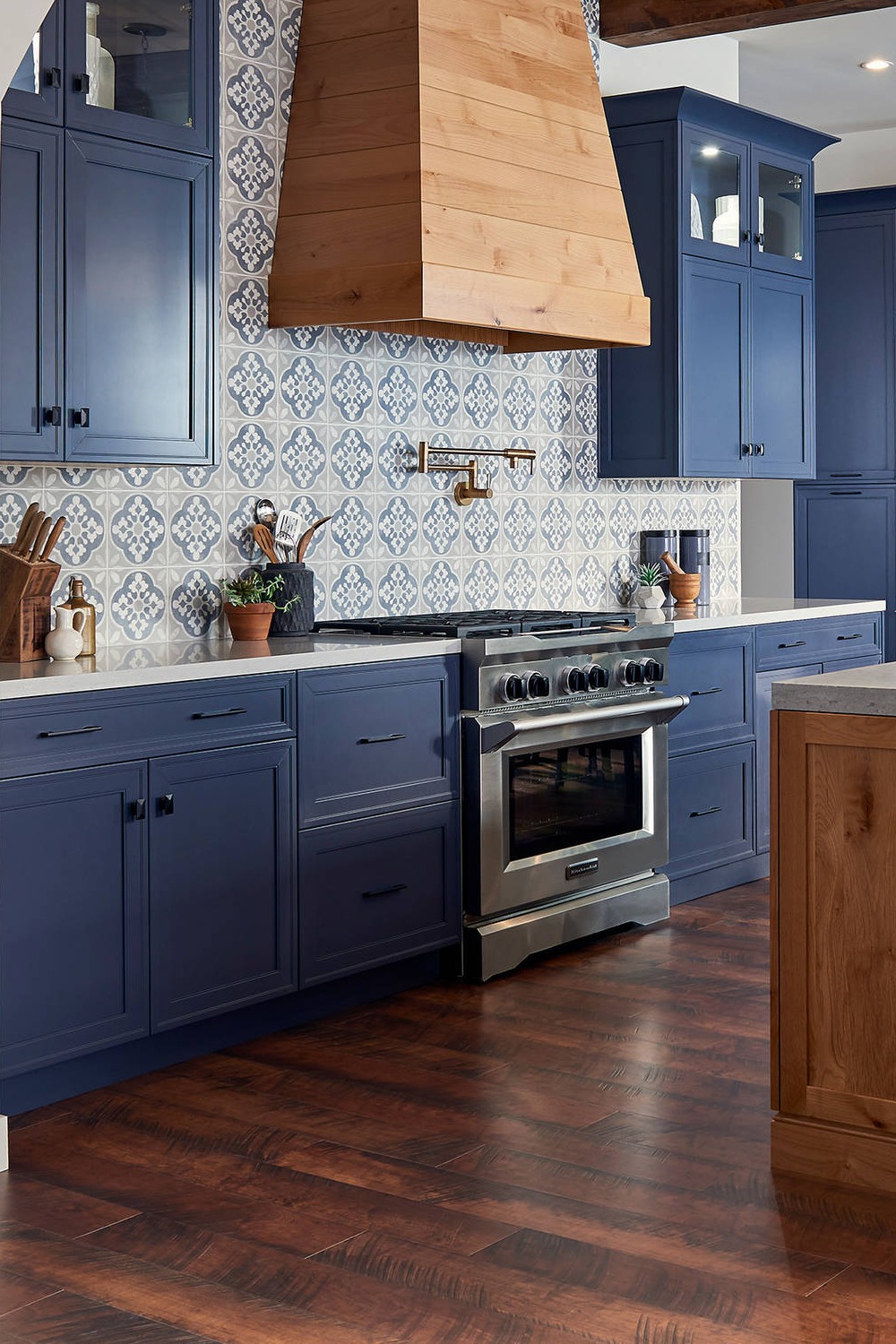 Blue Cabinets White Quartz Countertops Multi Colored Tile Backsplash Dark Wood Floor