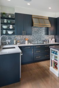 Blue Shaker Cabinetry White Quartz Countertops Multi Color Mosaic Tile Backsplash Dark Wood Floor