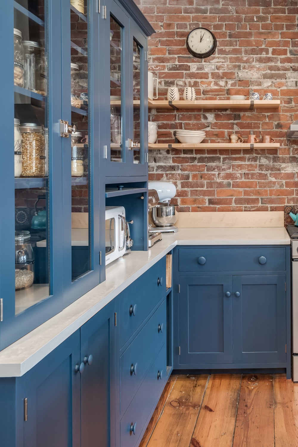 Blue Shaker Cabinets Brick Backsplash White Quartz Countertops Natural Wood Floor