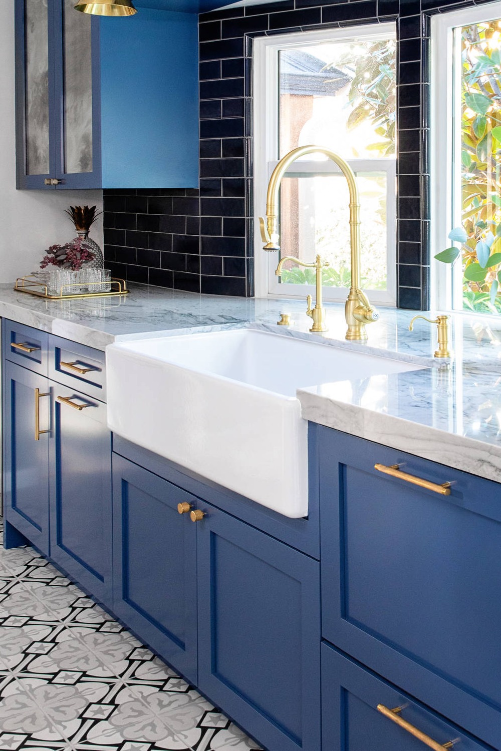 Blue Shaker Cabinets White Quartzite Countertops Black Subway Backsplash Multi Color Porcelain Floor Tile