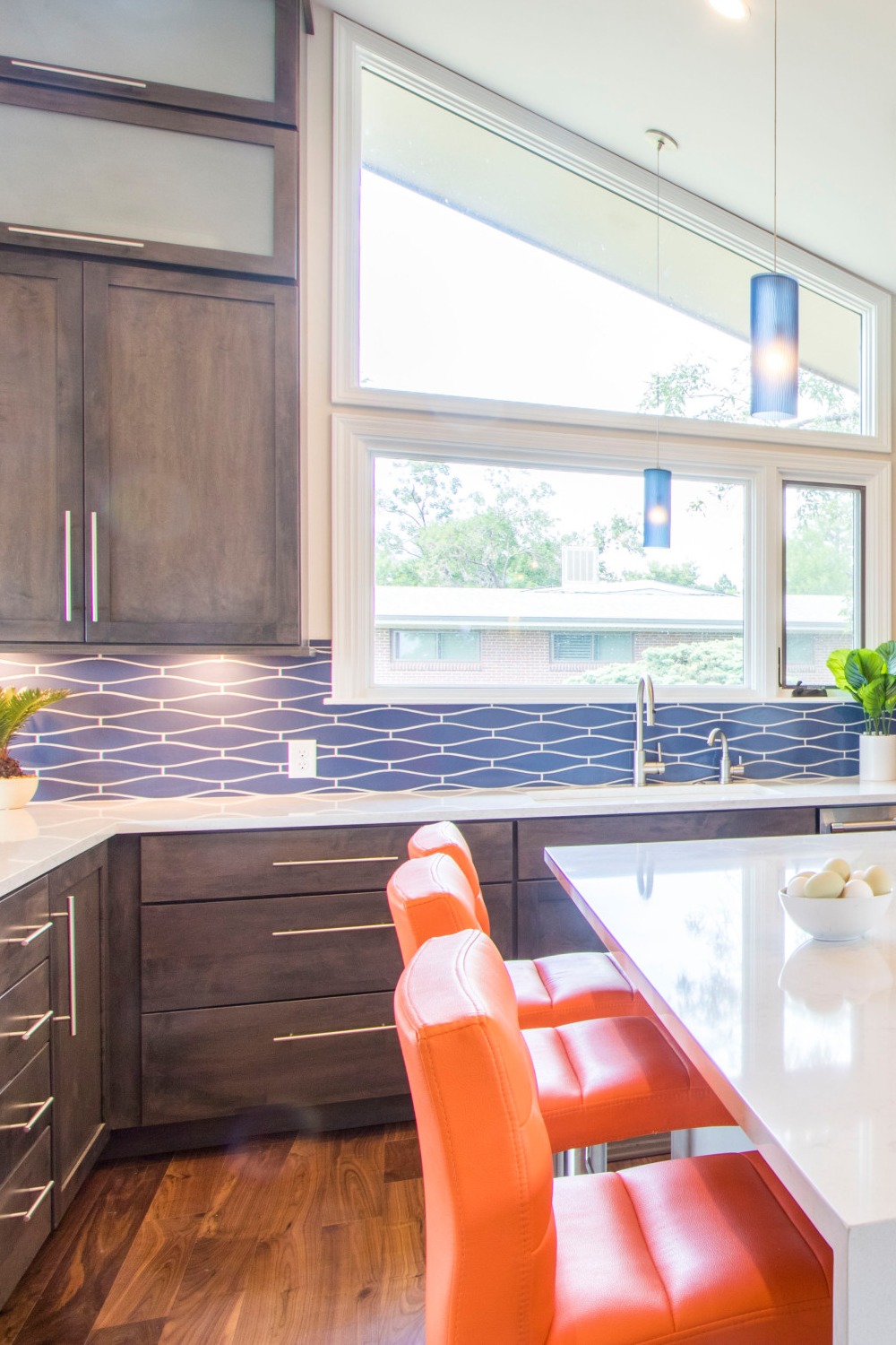 Blue Wave Tile Kitchen Backsplash Shaker Gray Cabinetry White Quartz Countertops Dark Wood Floor