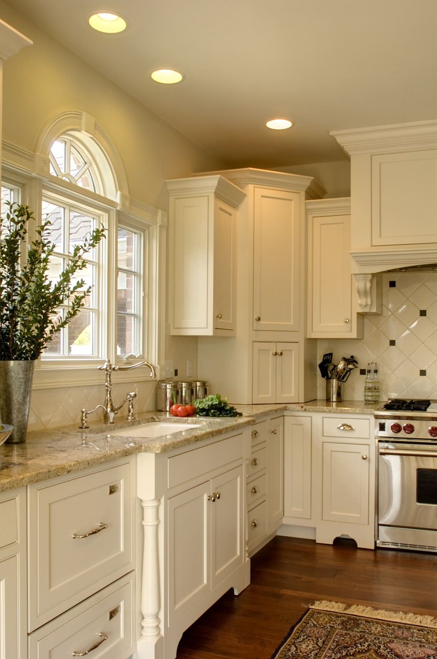 Dark Hardwood Floor Cream Cabinets Gold Color Granite Countertops White Backsplash Tiles