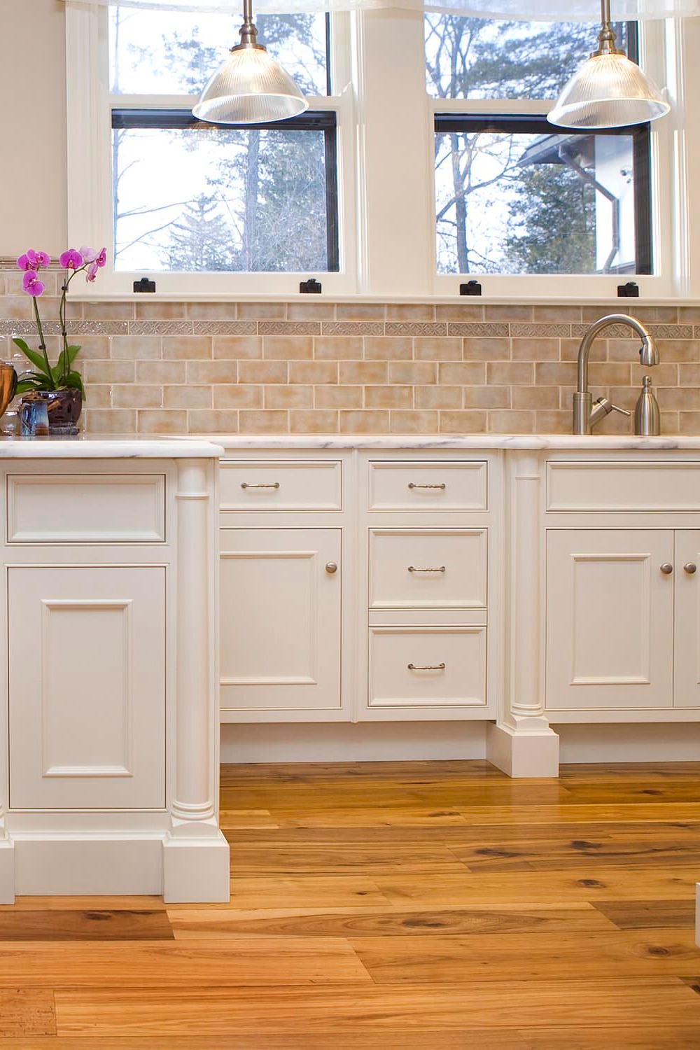 Light Wood Floor White Cabinets Beige Subway Backsplash Tile Marble Countertops