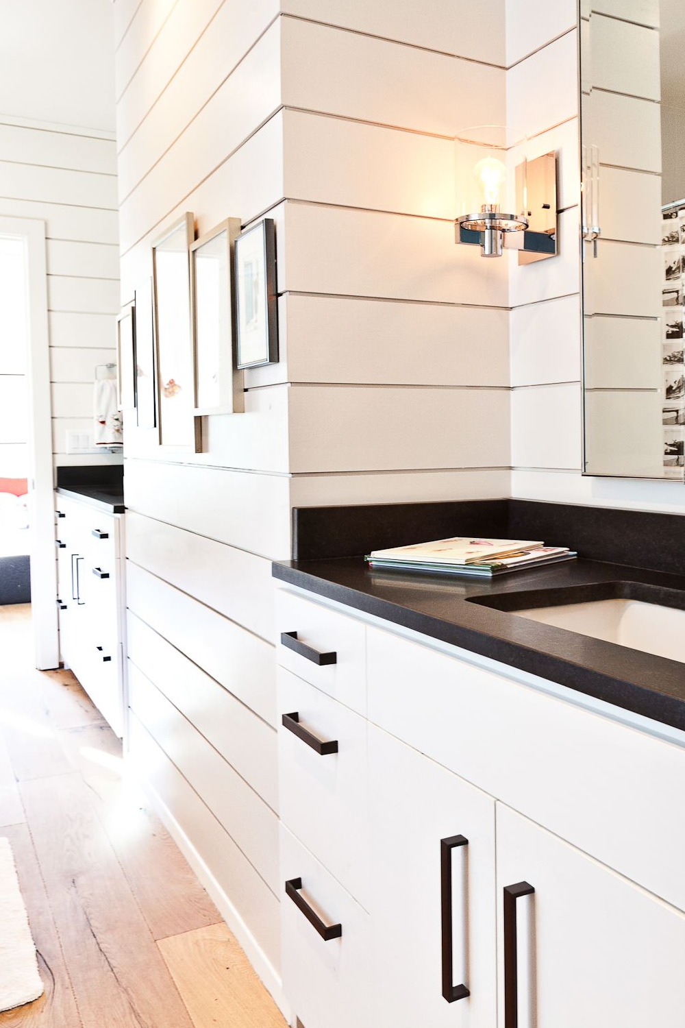 White Cabinets Black Honed Granite Countertops Backsplash Light Wood Floor