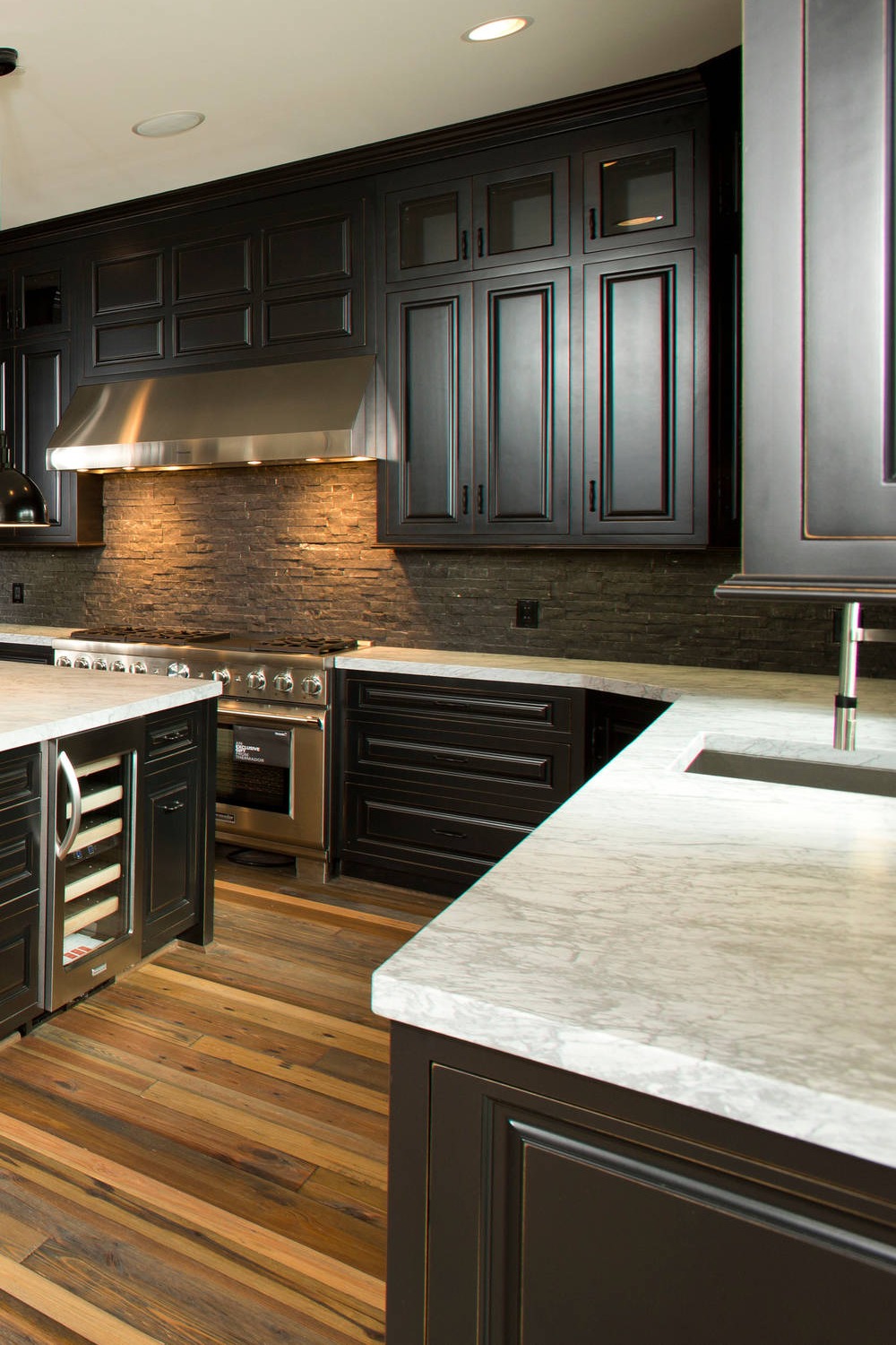 White Marble Tops Black Cabinets Stone Tile Backsplash Natural Wood Color Floor