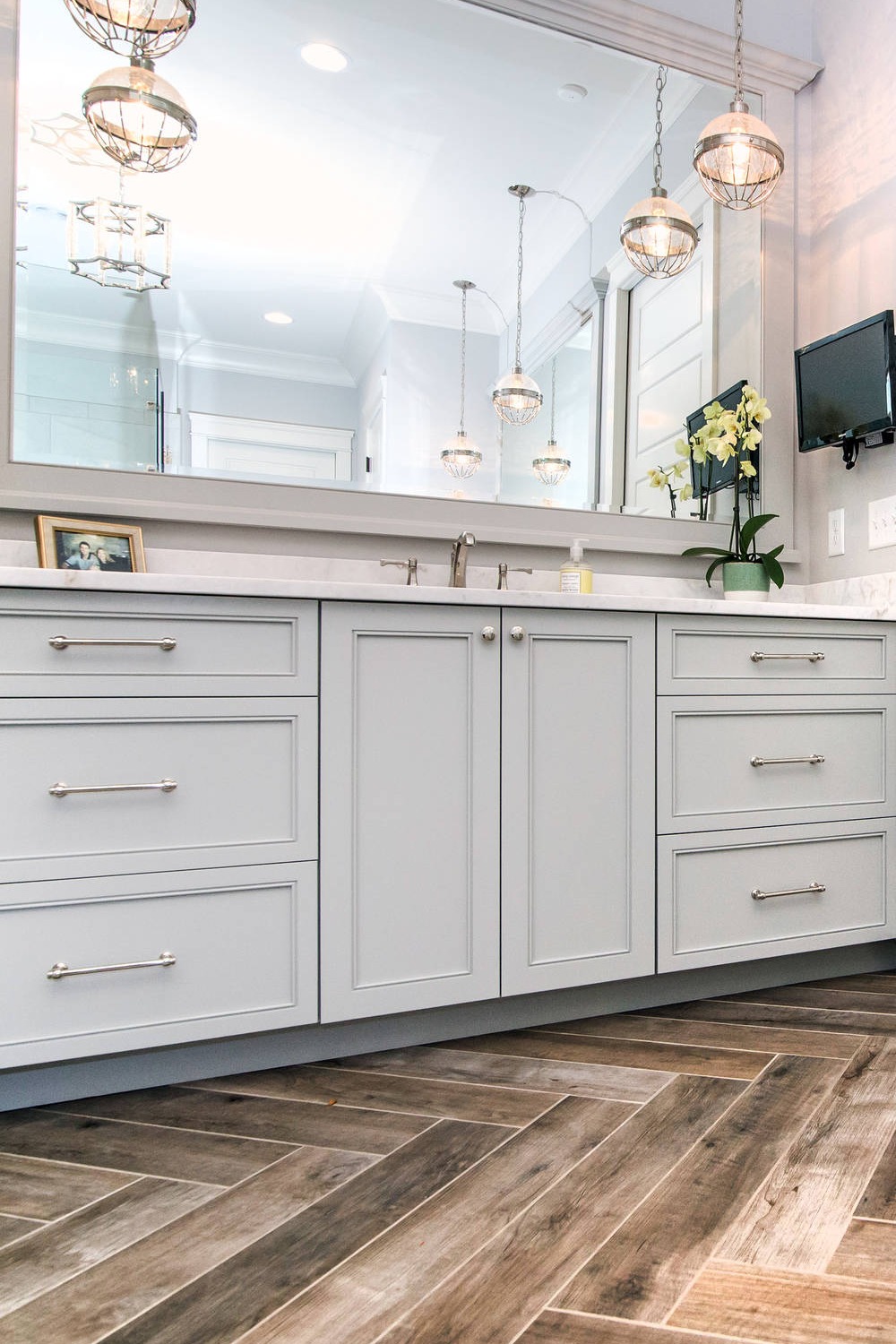 White Quartz Countertops Gray Cabinets Brown Porcelain Floor Tiles master bathroom with white countertops