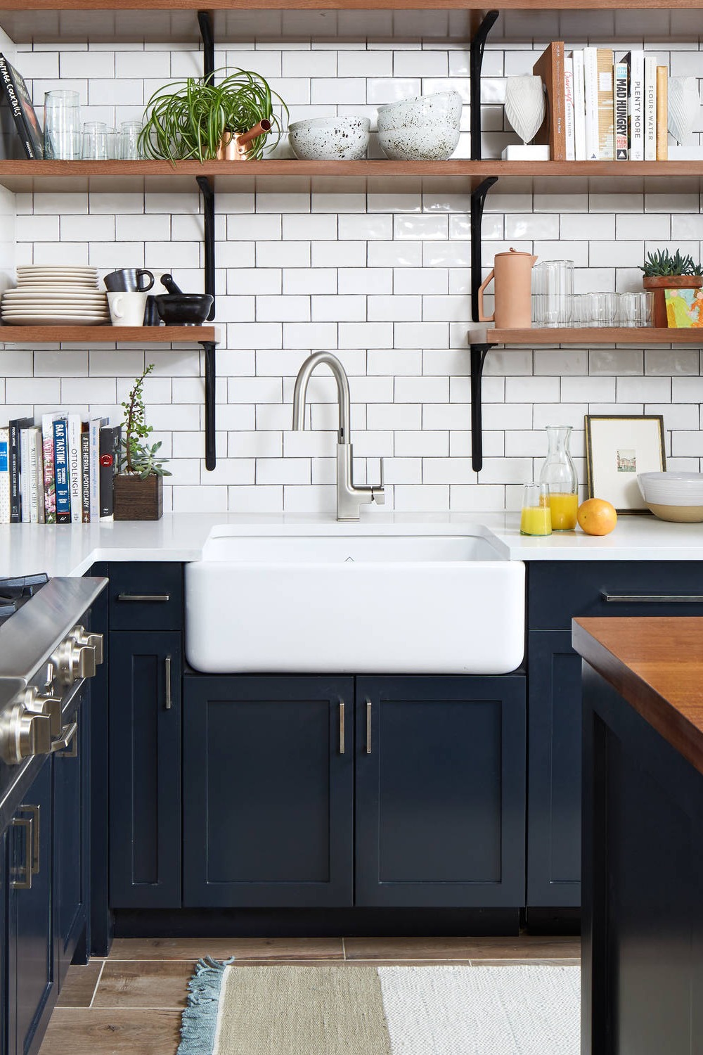Blue Shaker Cabinets White Quartz Countertops Subway Tile Backsplash Porcelain Brown Floor Farmhouse Sink