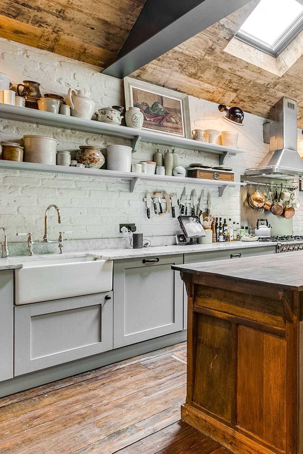 Gray Shaker Cabinets Wood Marble Countertops White Brick Backsplash Dark Floor Farmhouse Sink
