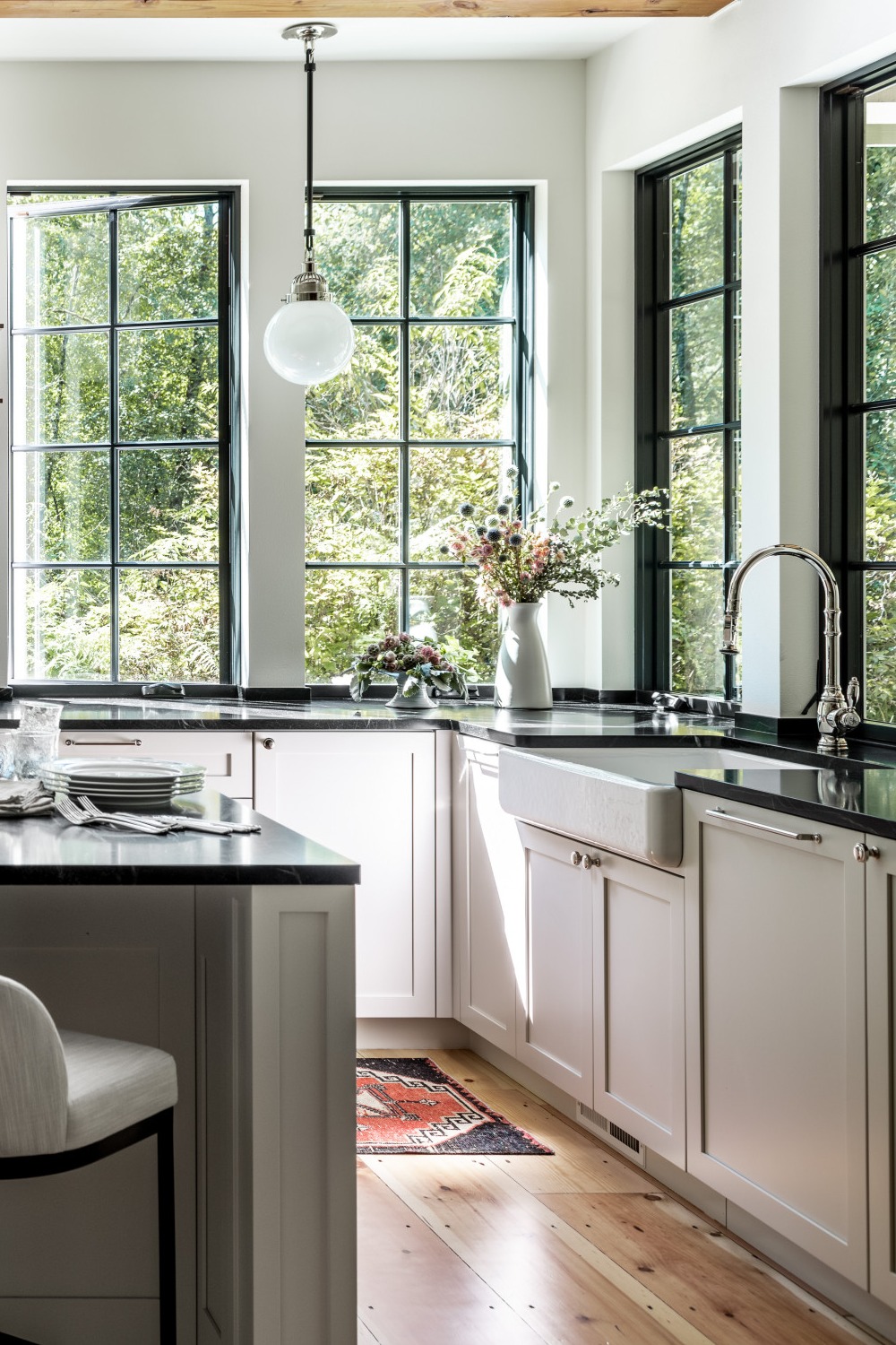 Light Gray Shaker Cabinets Black Countertops Wood Floor Farmhouse Sink