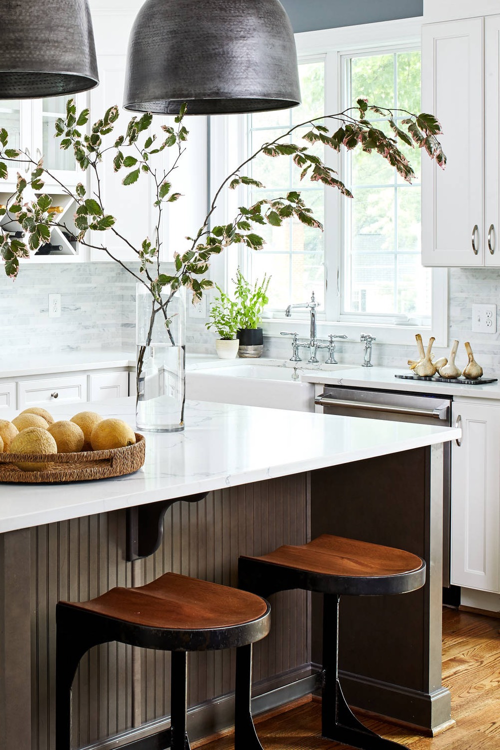White Kitchen Cabinets Gray Tile Backsplash Quartz Countertops Farmhouse Sink Brown Wood Floor