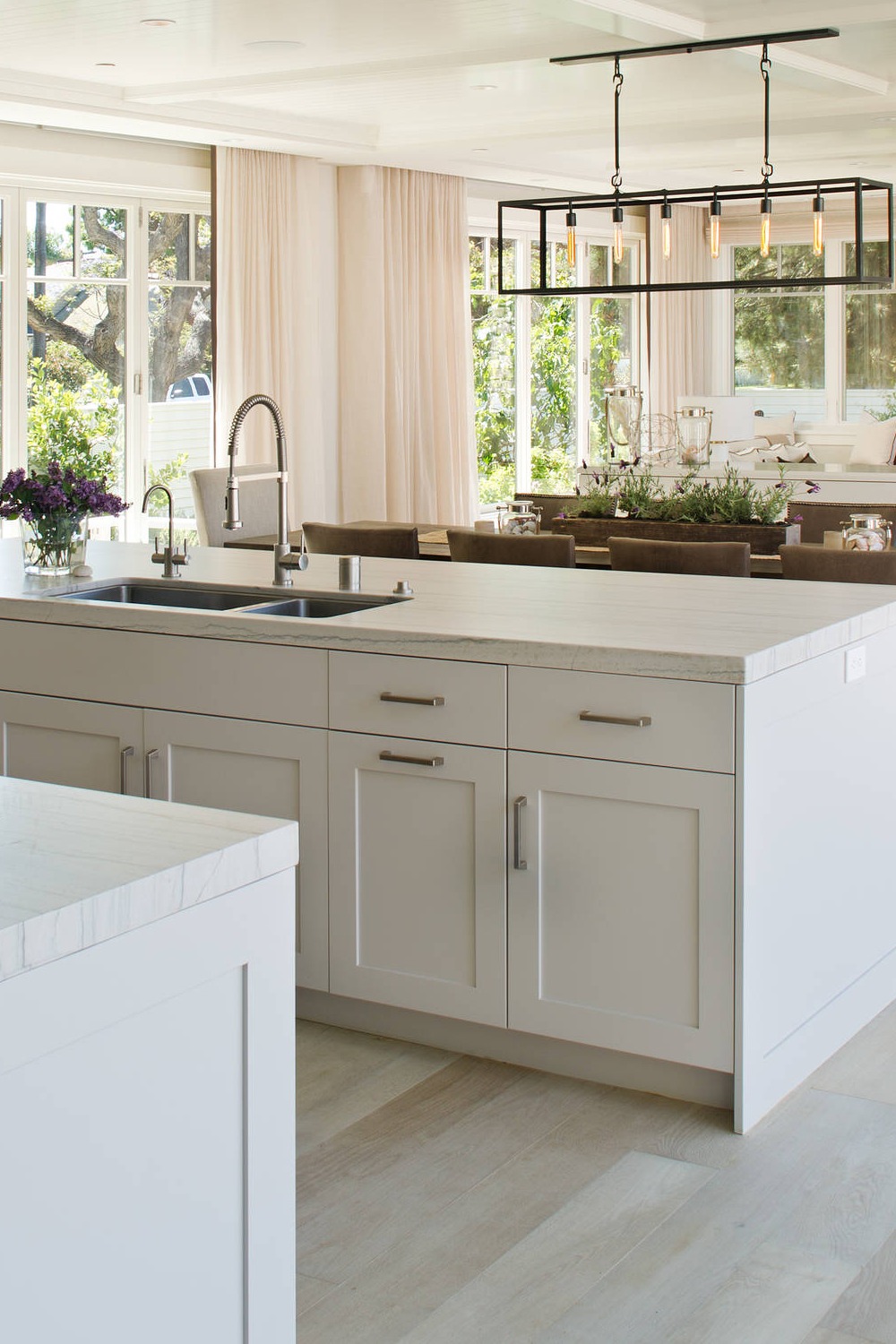 Beige Floor Open Concept Kitchen Honed Quartzite Counters White Cupboards