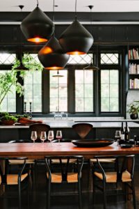 Black Kitchen Pendant Lighting Over Island Cabinets White Marble Countertops Dark Wood Floor