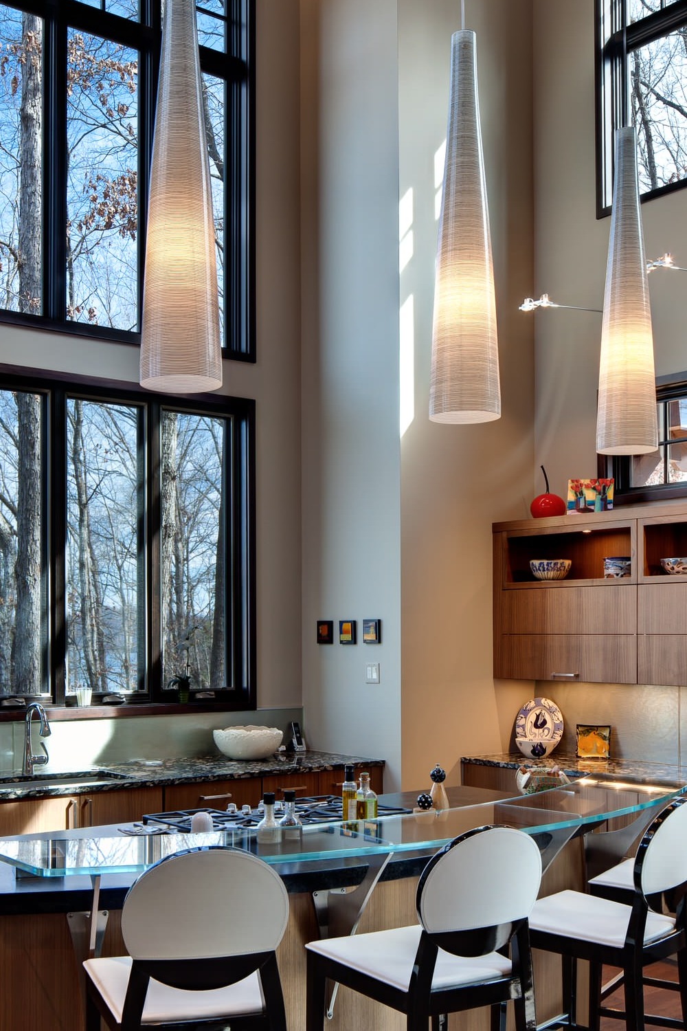 Flat Panel Brown Cabinets Pendant Lightings GreenBacksplash Tiles Dark Wood Floor Granite Countertops