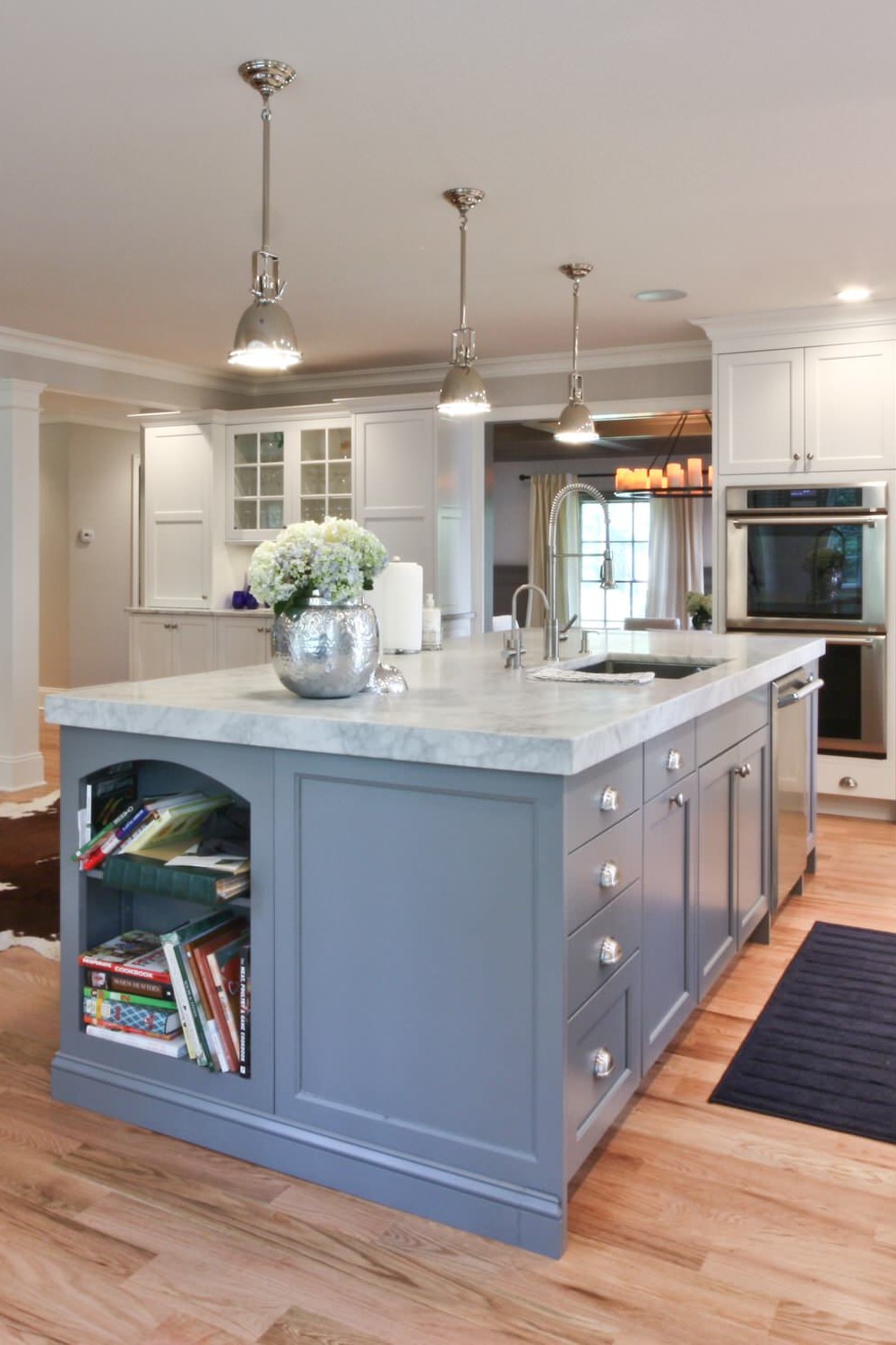 Gray Island White Kitchen Shaker Cabinets Quartzite Countertops Light Wood Floor Pendant Lightings