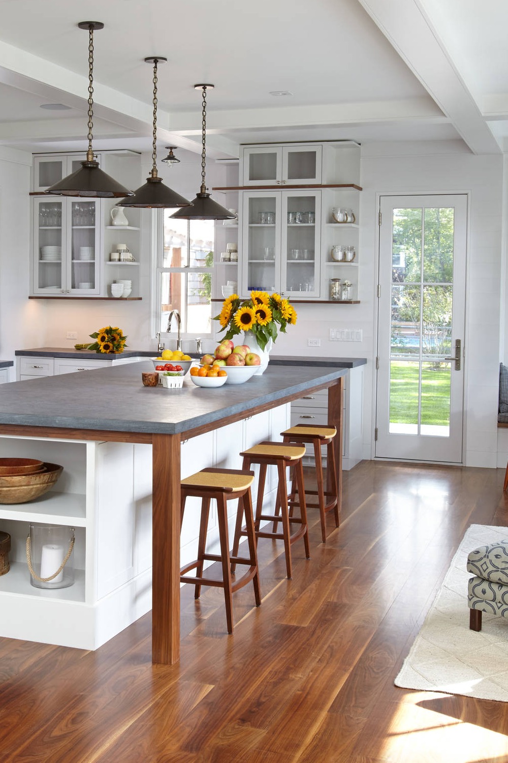 Open Concept Kitchen White Shaker Cabinets Dark Wood Floor Pendant Lightings