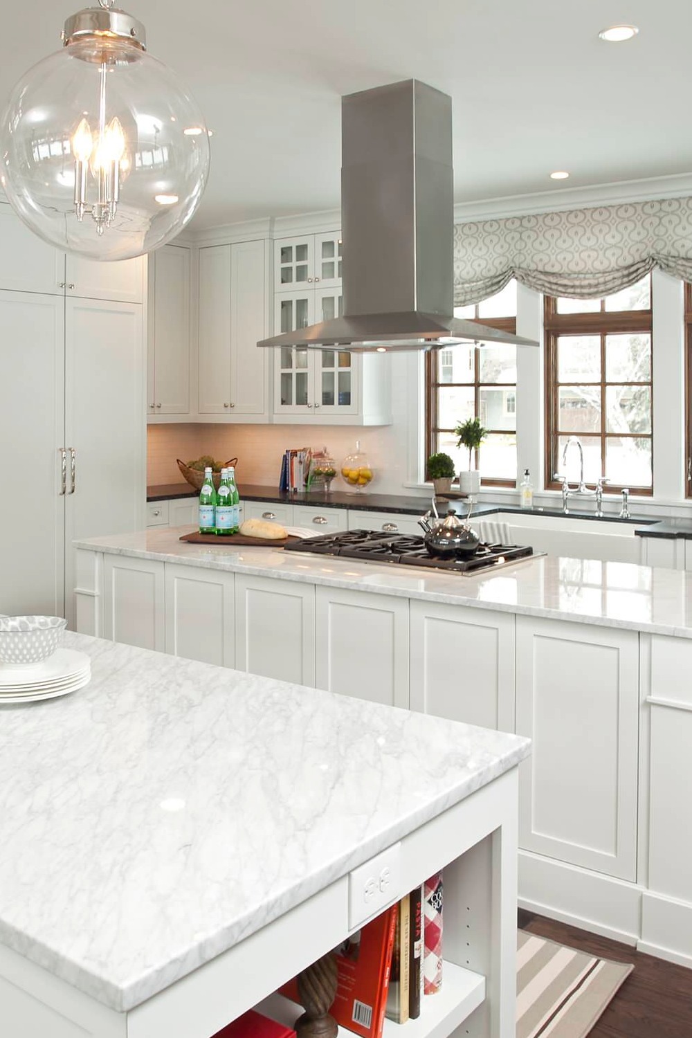 White Shaker Cabinetry Double Island Kitchen Carrara Marble Counters Farmhouse Sink Dark Flooring