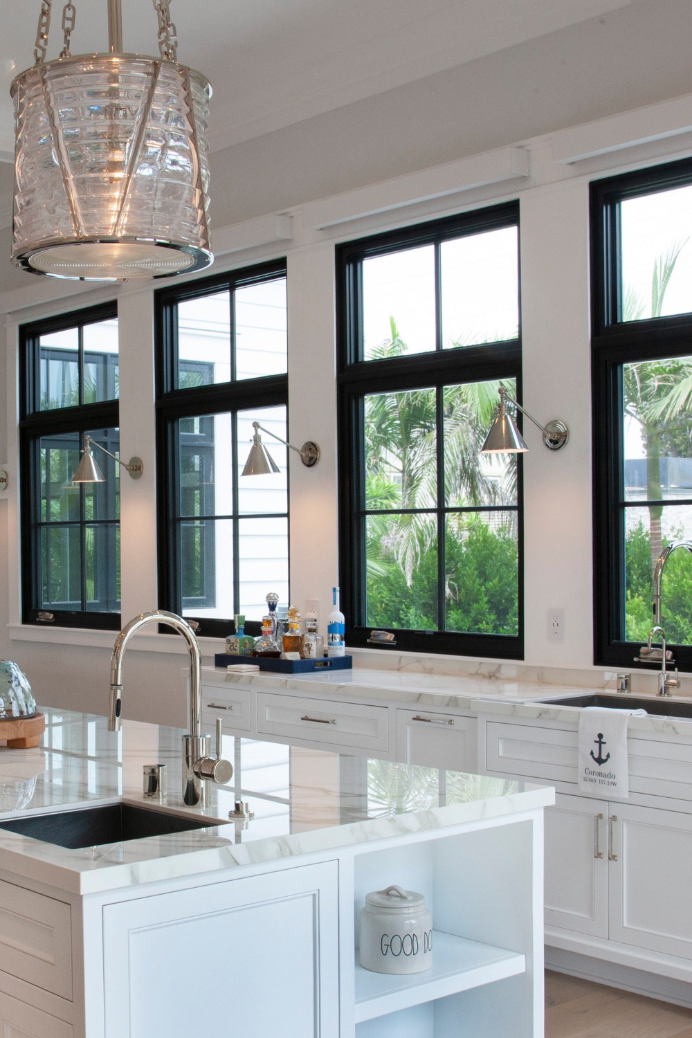 Beach Style White Kitchen Black Windows Light Hardwood Flooring Quartz Counters Cabinetry