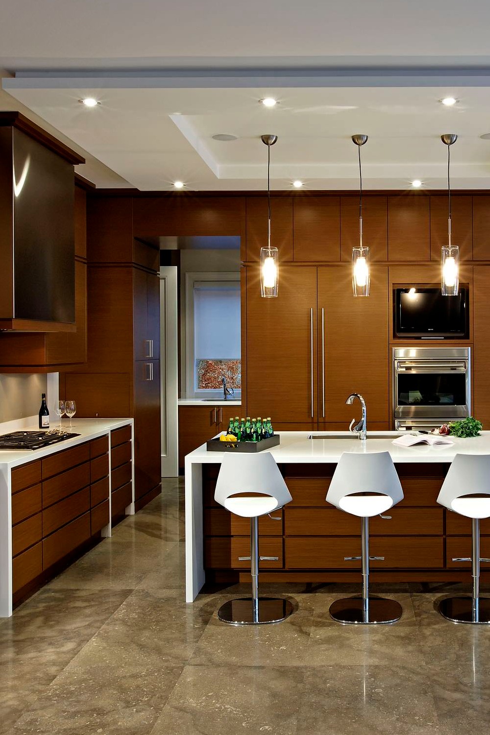 Dark Wood Cabinetry Quartz Counters Large Size Floor Tiles Pendant Lights Dropped Ceiling