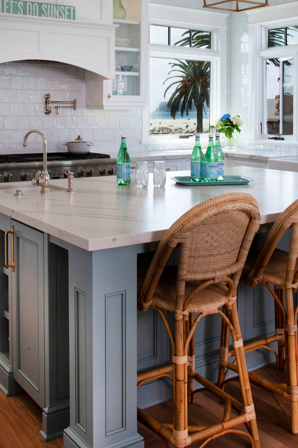 Medium Dark Hardwood Flooring Porcelain Backsplash Tile Quartz Counters Farmhouse Sink White Blue Cabinetry