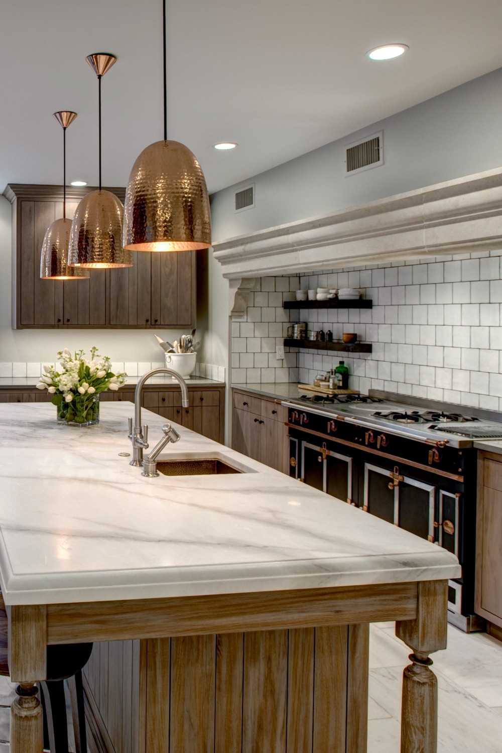 Traditional Classic Kitchen Ceramic Subway Tile Dark Cabinetry Hammered Copper Pendant Litghtings Marble Counters