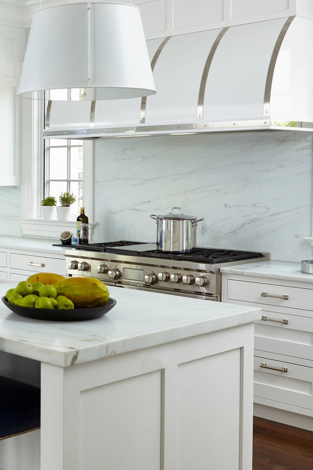 White Marble Counters Stone Slab Backsplash Shaker Cabinets Dark Hardwood Flooring