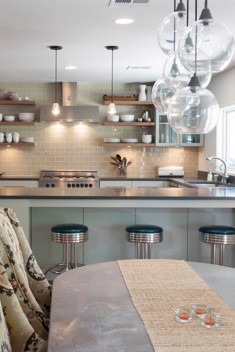 Concrete Grey Counters Taupe Green Glass Subway Tiles Flat Panel Cabinetry Hardwood Flooring