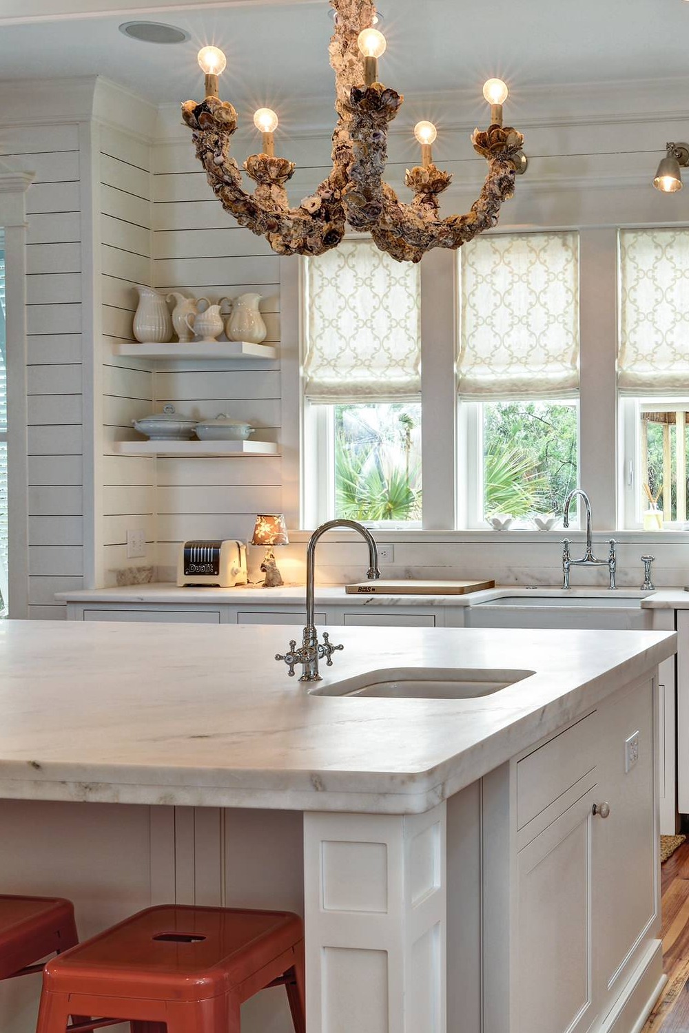 White Honed Marble Counters Backsplash Cabinetry Farmhouse Sink Shelf Hardwood Flooring
