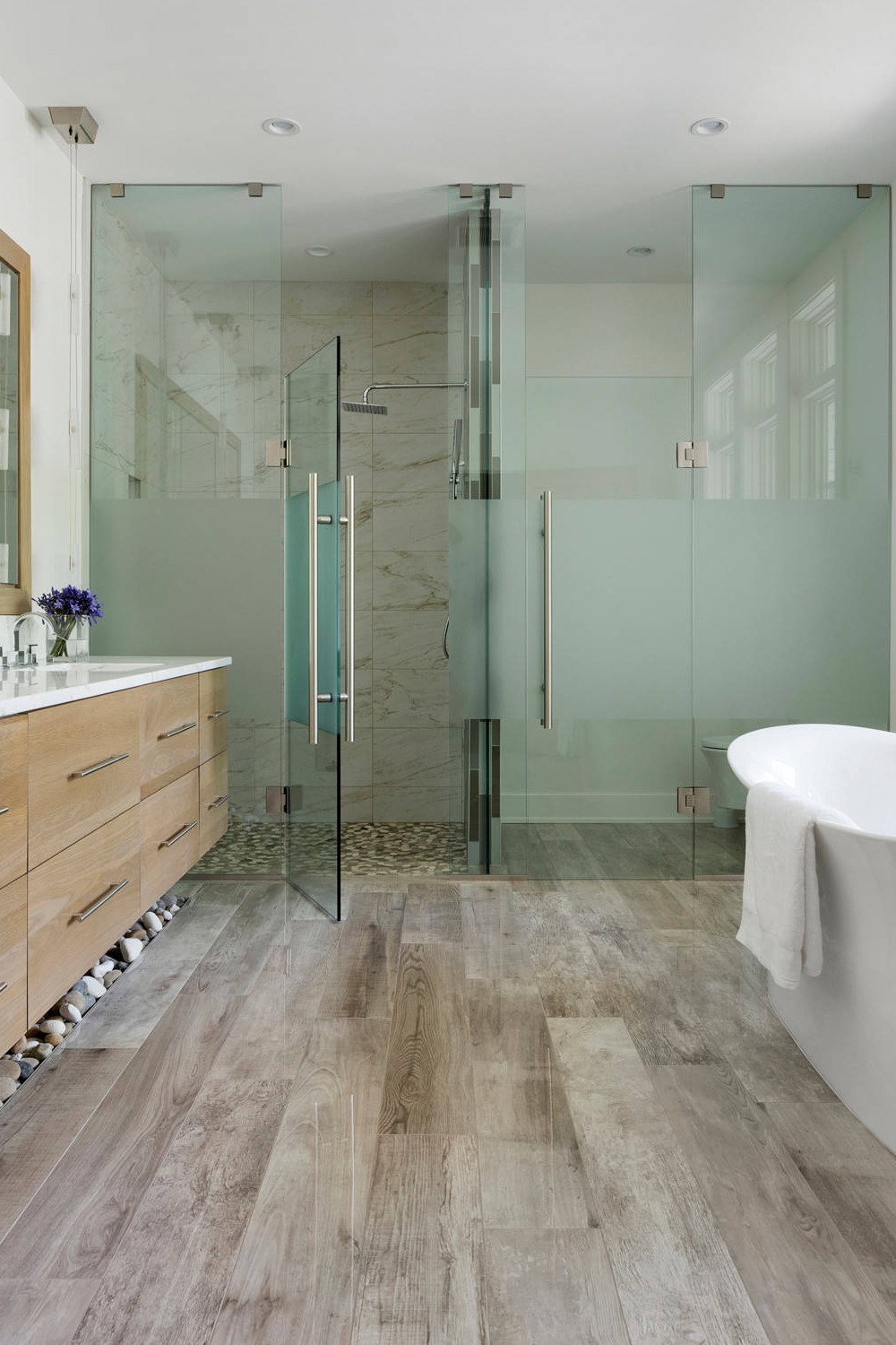 Medium Tone Wood Cabinetry White Quartz Countertop Freestanding Bath Tub Cottage Beige Tile Hinged Door