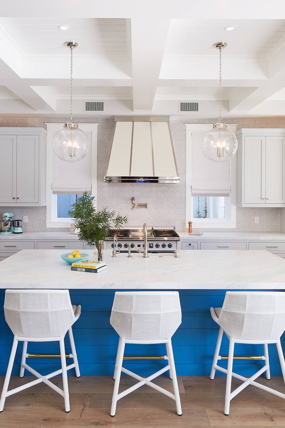 Blue Island White Shaker Kitchen Cabinet Marble Counters Medium Tone Hardwood Flooring Beige Backsplash