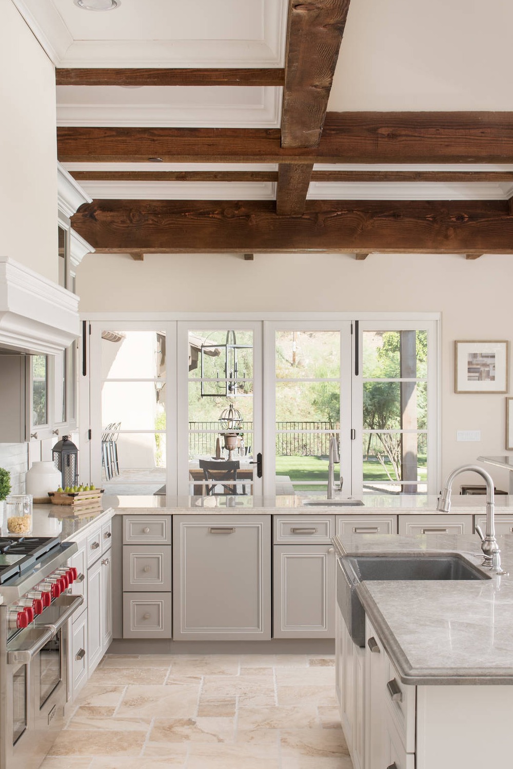 Grey Quartz Counters Farmhouse Sink Cream Travertine Natural Stone Floor Cabinetry
