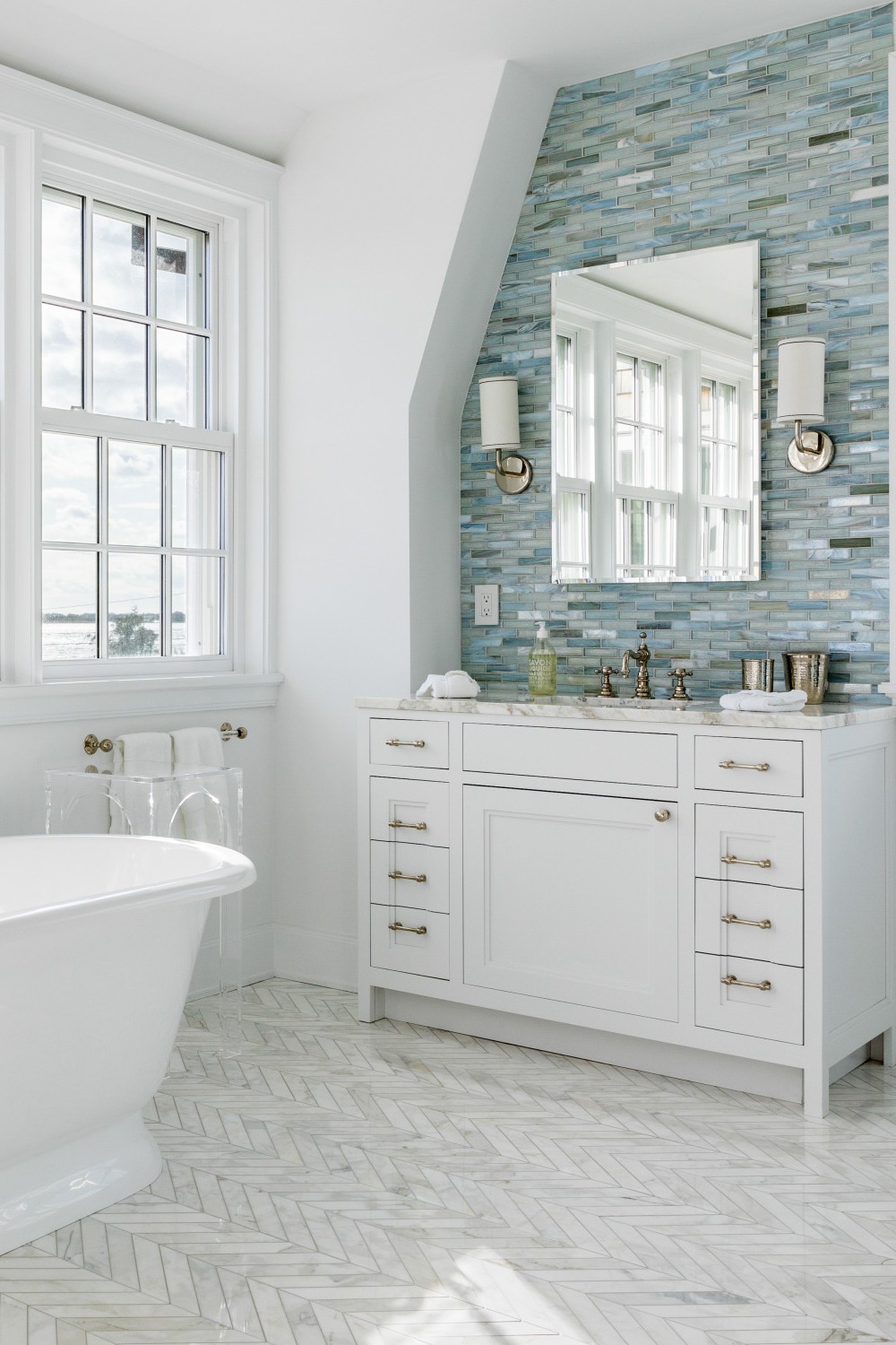 Relaxed Atmosphere White Bathroom Circular Window Coastal Theme Create Tub Sink Natural Materials Light Blues Add Natural Texture