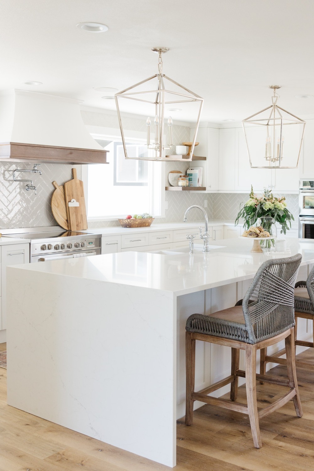 White Kitchen Cabinets White Cabinets Gray Subway Farmhouse Sink Pendant Lights Modern Chairs