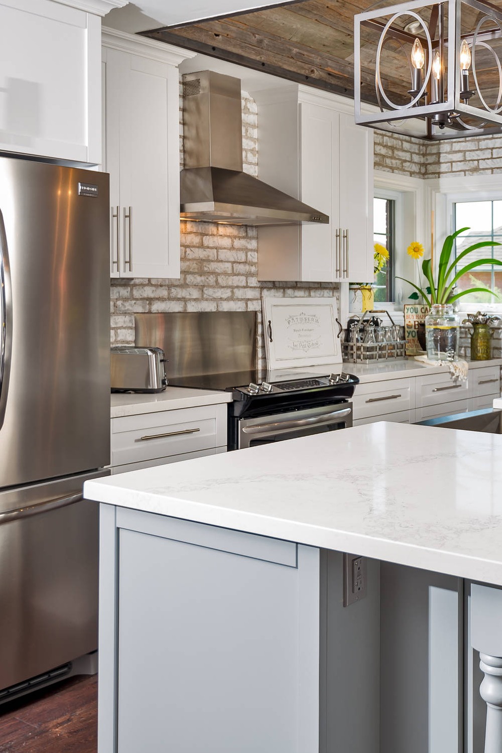 Stainless Steel Appliances White Backsplash Kitchen Design